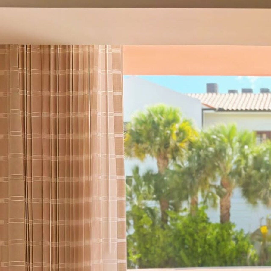Custom drapery framing a bright Florida view